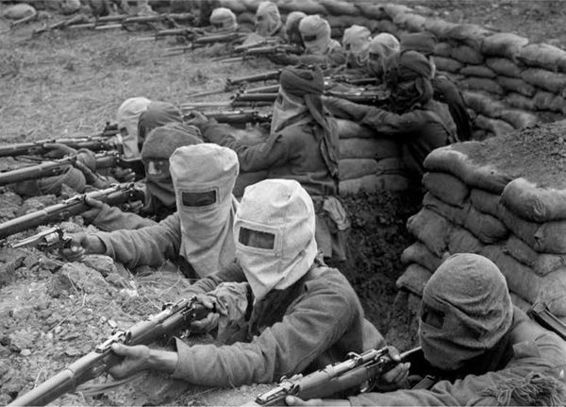 Indian troops practise a drill with gas masks prior to the second battle of Ypres, April–May 1915